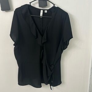 Flowy black blouse with button and tie